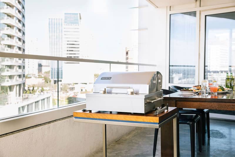 coyote-portable-grill-C1EL120SM-right-angle-view-balcony.jpg